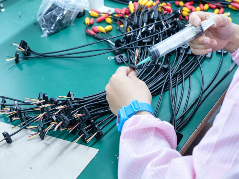Camera cable sealing during assembly